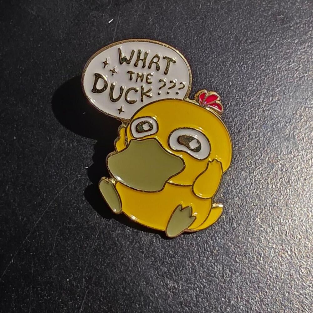 Pokemon Psyduck pin with speech bubble saying 'WHAT THE DUCK???'